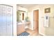Bathroom features vanity, sink, and access to a second bathroom at 1608 Forest Hills Ln, Haines City, FL 33844