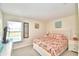 Bedroom with king-size bed, TV, and pool view at 1608 Forest Hills Ln, Haines City, FL 33844