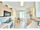 Bright kitchen with ample counter space, white appliances, and a breakfast nook at 1608 Forest Hills Ln, Haines City, FL 33844