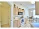 Beige kitchen with black appliances and a breakfast nook at 1608 Forest Hills Ln, Haines City, FL 33844