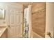 Clean bathroom with shower/tub combo and neutral tile at 1608 Forest Hills Ln, Haines City, FL 33844