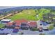 Aerial view of the clubhouse and surrounding golf course at 1608 Forest Hills Ln, Haines City, FL 33844