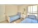 Bedroom with two twin beds, nightstand, and window at 1608 Forest Hills Ln, Haines City, FL 33844