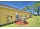 Home's exterior with AC unit and landscaping at 1608 Forest Hills Ln, Haines City, FL 33844