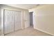 Spacious bedroom with double door closet and access to another room at 1608 Forest Hills Ln, Haines City, FL 33844