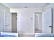Bedroom with two beds, and access to bathroom and closet at 1608 Forest Hills Ln, Haines City, FL 33844