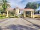 Community gated entrance with guardhouse at 1608 Forest Hills Ln, Haines City, FL 33844