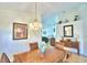 Dining area featuring a wooden table, chairs, and decorative wall art at 1608 Forest Hills Ln, Haines City, FL 33844