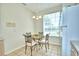 Small breakfast nook with a glass-top table and wrought iron chairs at 1608 Forest Hills Ln, Haines City, FL 33844