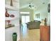 Living room with tile floors and access to backyard at 1608 Forest Hills Ln, Haines City, FL 33844
