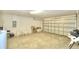 Garage with overhead door and ample space for storage at 1608 Forest Hills Ln, Haines City, FL 33844