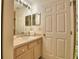 Clean bathroom with vanity, sink, and shower at 1608 Forest Hills Ln, Haines City, FL 33844