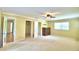 Primary bedroom with carpet, multiple closets and ensuite bath at 1950 El Paso Trl, Bartow, FL 33830