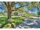 Mature oak tree with Spanish moss shades the front yard at 1950 El Paso Trl, Bartow, FL 33830