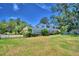 Two-story house with brick and white siding, situated on a large lot at 1950 El Paso Trl, Bartow, FL 33830