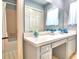Clean bathroom with vanity, large mirror and tub with shower at 1950 El Paso Trl, Bartow, FL 33830