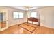 Hardwood floor bedroom with ceiling fan and window at 1950 El Paso Trl, Bartow, FL 33830