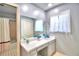 Updated bathroom with vanity, mirror, and a shower/tub combo at 1950 El Paso Trl, Bartow, FL 33830
