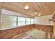 Sunroom addition with brick walls, wood ceiling, and a ceiling fan at 1950 El Paso Trl, Bartow, FL 33830