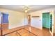 Bedroom with hardwood floors, ceiling fan, and closet at 1950 El Paso Trl, Bartow, FL 33830