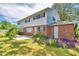 Brick and white two-story home with spacious backyard and patio at 1950 El Paso Trl, Bartow, FL 33830