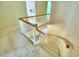 Elegant curved staircase with carpeted steps and wooden railing at 1950 El Paso Trl, Bartow, FL 33830