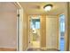 Hallway with light walls and wood flooring, leading to bathroom and bedrooms at 1950 El Paso Trl, Bartow, FL 33830