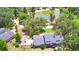 Aerial view of house near a lake, showcasing large lot at 1950 El Paso Trl, Bartow, FL 33830