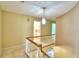 Upper hallway with carpet, light walls, and access to bathroom at 1950 El Paso Trl, Bartow, FL 33830