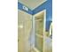 Bathroom with shower and door at 1950 El Paso Trl, Bartow, FL 33830