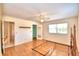 Hardwood floor bedroom with a ceiling fan and a closet at 1950 El Paso Trl, Bartow, FL 33830