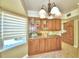 Eat in kitchen with wood cabinets at 1950 El Paso Trl, Bartow, FL 33830
