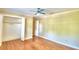 Bright bedroom with wood floors and ample closet space at 1950 El Paso Trl, Bartow, FL 33830