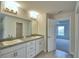 Double vanity bathroom with granite countertops at 4073 Tullamore Ln, Auburndale, FL 33823