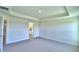 Primary bedroom with carpet flooring and en-suite bathroom at 4073 Tullamore Ln, Auburndale, FL 33823