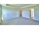 Spacious bedroom with carpet flooring and access to bathroom at 4073 Tullamore Ln, Auburndale, FL 33823