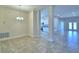 Dining area with tile floors and an open concept design adjoining the kitchen at 4073 Tullamore Ln, Auburndale, FL 33823