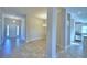 View of the foyer showcasing tile flooring and views into the dining and kitchen areas at 4073 Tullamore Ln, Auburndale, FL 33823