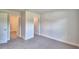 Spacious bedroom with plush carpeting and access to bathroom and walk-in closet at 4073 Tullamore Ln, Auburndale, FL 33823