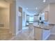 Open concept kitchen with white cabinets, granite countertops and an island at 4073 Tullamore Ln, Auburndale, FL 33823