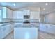 Modern kitchen with large island and stainless steel appliances at 4073 Tullamore Ln, Auburndale, FL 33823
