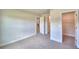 Bright bedroom featuring carpet, and convenient access to bathroom and closet at 4073 Tullamore Ln, Auburndale, FL 33823