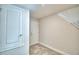 Laundry room with built-in shelving and overhead storage at 4073 Tullamore Ln, Auburndale, FL 33823