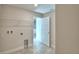 Spacious laundry room with access to a bathroom at 4073 Tullamore Ln, Auburndale, FL 33823