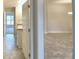 View of the hallway leading to bedrooms and a living area at 4073 Tullamore Ln, Auburndale, FL 33823