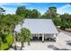 Modern farmhouse with metal roof and large backyard at 12510 Lake Hatchineha Rd, Haines City, FL 33844