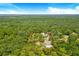 Aerial view of property showcasing two homes at 12510 Lake Hatchineha Rd, Haines City, FL 33844