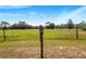 Wooden post with property marker in grassy field at 12510 Lake Hatchineha Rd, Haines City, FL 33844