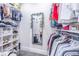 Well-organized walk-in closet with ample shelving and hanging space at 12510 Lake Hatchineha Rd, Haines City, FL 33844
