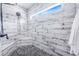 Large walk-in shower with pebble floor and modern fixtures at 12510 Lake Hatchineha Rd, Haines City, FL 33844